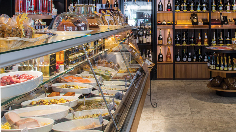 interior Peck food store deli case wine shelves